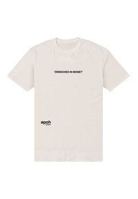 Bílé bavlněné tričko s černým textem: "Promočený v Monetu" uprostřed na hrudi a "apoh London" v dolním levém rohu.