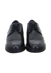 Black leather brogue shoes with decorative perforations and lace-up fronts, shown from the front on a white background.
