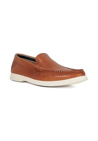 Brown leather slip-on shoe with a moc-toe design, featuring a contrasting white rubber sole and subtle stitching details along the upper.