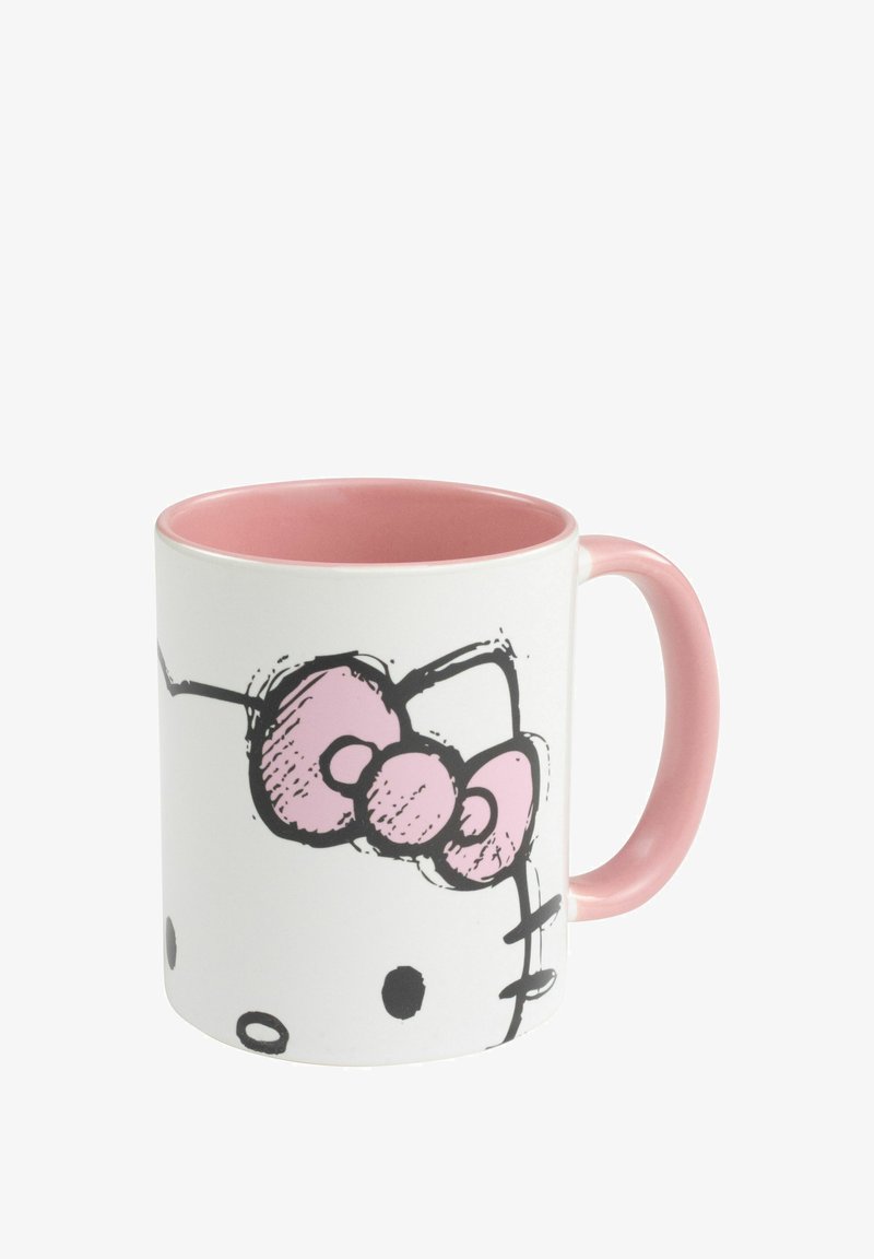Tazza in ceramica con esterno bianco, interno rosa e manico. Presenta un contorno nero del volto di un personaggio dei cartoni animati con un fiocco rosa.