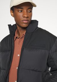 Tommy Hilfiger NEW YORK PUFFER JACKET - Giacca invernale - black