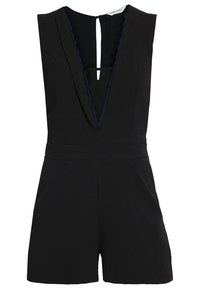 Combinaison noire avec un décolleté profond en V, design sans manches, et bordure festonnée au niveau du décolleté. Dispose d'une fermeture à boutons au dos et d'une coupe ajustée.