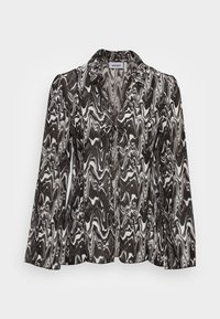 Blusa abstracta em preto e branco com padrão espiral, mangas longas, colarinho e detalhe de nó na parte da frente. Feita de tecido leve e suave.