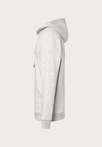 Helle graue Kapuzenjacke aus weichem Material, mit gefütterter Kapuze, Fronttasche und gerippten Bündchen. Minimalistisches Design mit Kordelzugverschluss.