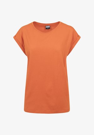 Camiseta de manga corta en algodón naranja brillante, con puños doblados, cuello redondo y un corte relajado. Diseño minimalista sin estampados.