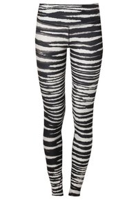 Leggings noir et blanc avec un motif à rayures zèbre. Confectionnés dans un tissu extensible, ils présentent une texture lisse et une coupe ajustée.