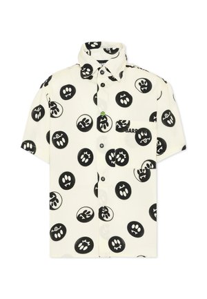 Biała koszula z krótkim rękawem na guziki, z czarnymi, okrągłymi abstrakcyjnymi wzorami twarzy i kieszenią na piersi po prawej stronie.