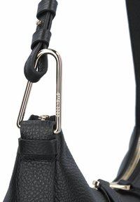Black leather handbag with a textured surface, featuring a gold-tone metal hardware loop and a zipper closure.