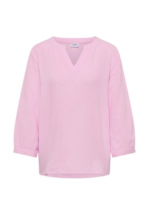 Blouse pour femmes rose clair avec manches trois-quarts et encolure en V, présentant un tissu texturé et une étiquette "CECIL" à l'intérieur du col.