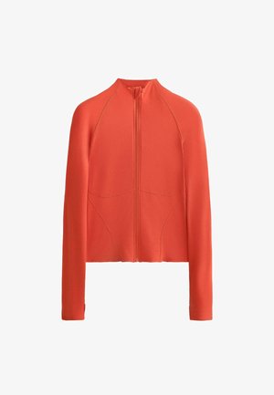 Veste rouge à zip avec col montant, manches longues et design sans coutures. Confectionnée en matière lisse et extensible avec des détails de couture discrets.