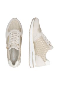 Beige sneakers featuring a mesh upper, leather accents, and a textured design; laced with a padded collar and cushioned sole.