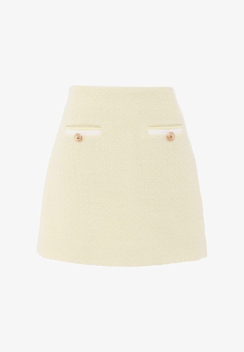 Mini spódnica z tweedu w jasnym żółtym kolorze o fakturowanym wykończeniu, z dwiema przednimi kieszeniami i kontrastowym białym wykończeniem, ozdobiona okrągłymi guzikami.