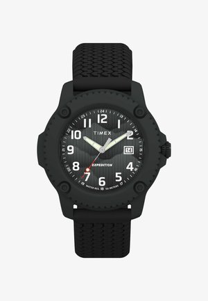 Melnas gumijas rokas pulkstenis ar teksturētu siksniņu, aprīkots ar apaļu melnu rāmīti, vertikāli svītrainu melnu ciparnīcu un baltām stundu atzīmēm. Sarkanā sekundžu rādītājs.