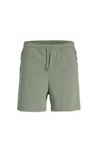 Zelené sportovní šortky vyrobené z měkké látky, mají elastický pas, šňůrku a boční zipové kapsy. Klasický design a pohodlný střih.