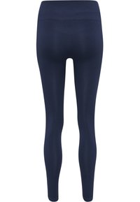 Donkerblauwe, naadloze leggings met hoge taille, van achteren getoond met subtiele contourdetails op taille en benen.