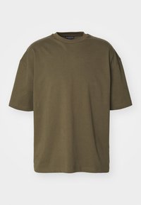 Oliven grøn kortærmet t-shirt i bomuldsmateriale med rund hals, afslappet pasform og lige kant med minimalt syning detaljer.