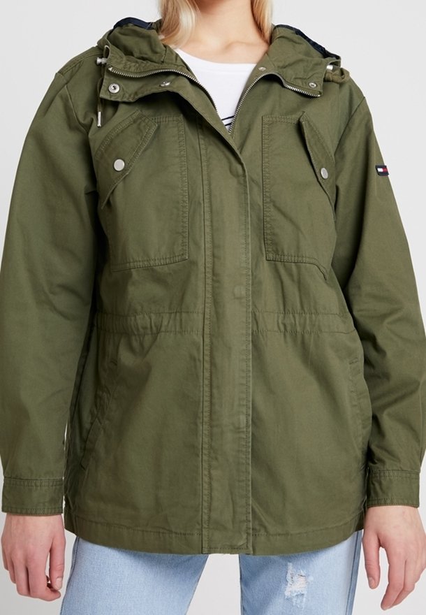 Olive green jacket with a hood, two front pockets, adjustable waistband, and a zippered closure. Made of lightweight fabric.