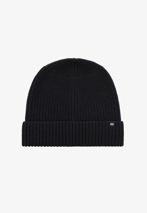 Szydełkowa czapka w ciemnym granacie, z prążkowaną teksturą i złożonym mankietem. Mała metka z logo znajduje się na mankiecie.