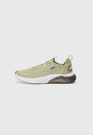 Baskets de sport en mesh vert olive clair avec semelle blanche, coussin d'air noir translucide, languettes de traction et fermeture à lacets, vue latérale sur fond gris.