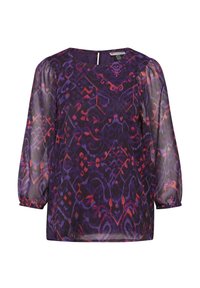 Blusa viola con maniche lunghe trasparenti, caratterizzata da un vivace motivo multicolore di spirali e forme. Dettaglio con apertura a chiave sulla schiena.
