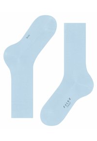 Calzini azzurri chiari realizzati in un materiale liscio, con un polsino a coste, punta rinforzata e etichetta del marchio sul fondo.