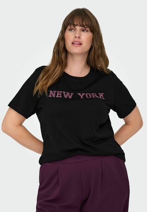 Black cotton t-shirt featuring a pink "NEW YORK" graphic on the front. The design has short sleeves and a crew neckline, paired with purple pants.