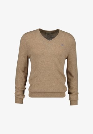 Beige V-neck sweater made of soft fabric, featuring long sleeves and ribbed cuffs and hem. Small logo detail on the left chest.