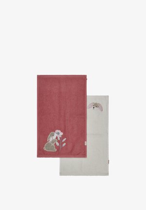 Two towels: one deep pink with a bunny and flower embroidery, and one light beige with a bunny face. Both have textured fabric and neat edges.
