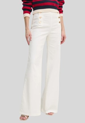 Jeans a zampa - neve