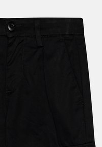 Jack & Jones Junior JPSTBILL JJCLEAN TAPERED - Kapsáče - black
