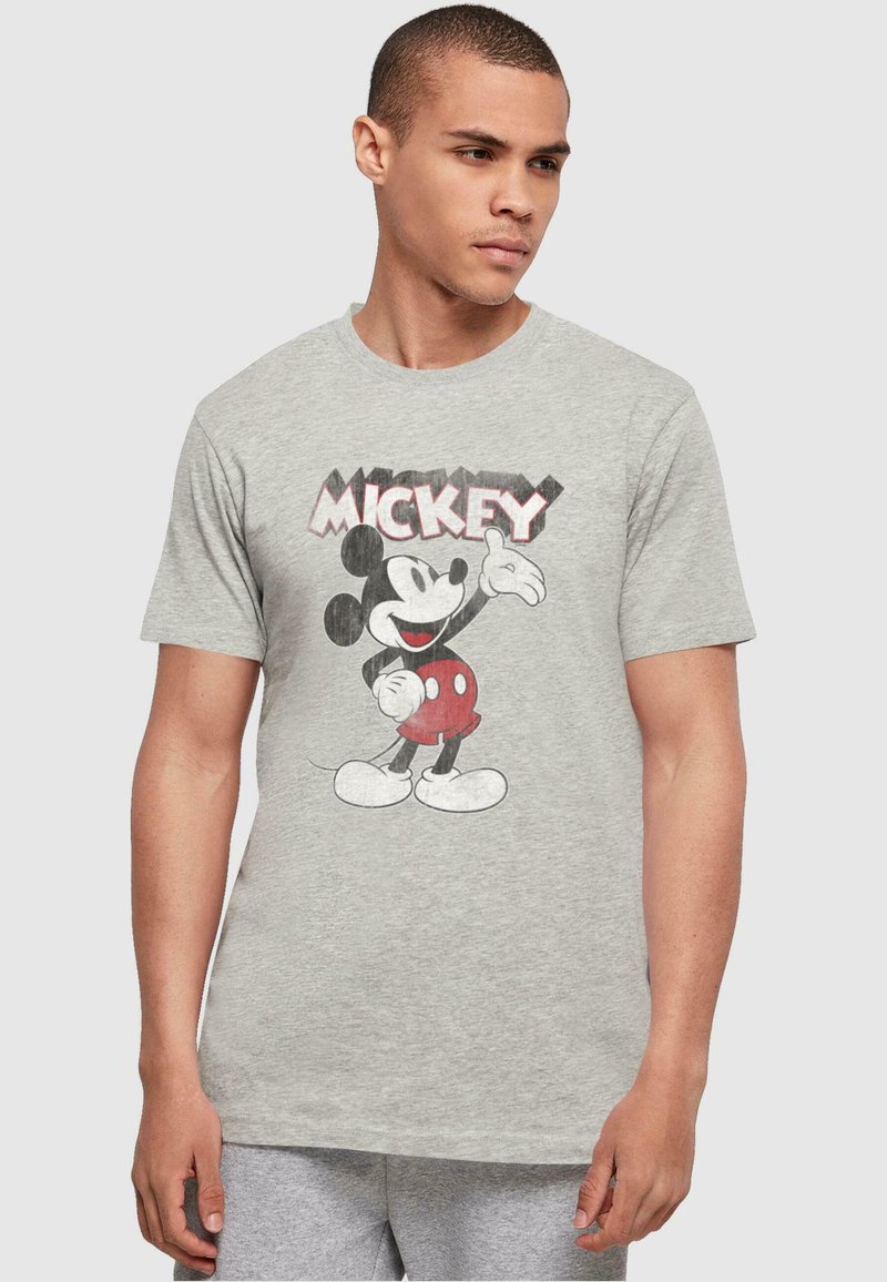 Camiseta de algodón gris con un gráfico vintage de Mickey Mouse en negro y rojo. Mangas cortas y cuello redondo.