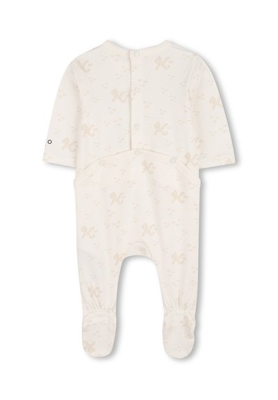 Tutina per bambino a manica lunga in crema chiaro con motivi color marrone chiaro. Presenta chiusura a scatto sul retro, polsini elasticizzati e design con piedini.