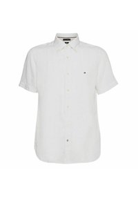 Camisa de lino blanca de manga corta con cuello abotonado, que presenta un pequeño logotipo en el lado izquierdo del pecho y cierres de botón visibles.