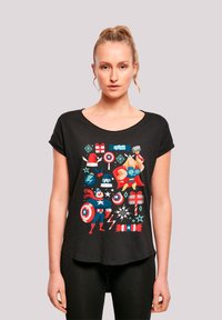 Black short-sleeve t-shirt featuring colorful superhero graphics including Captain America and Thor, with various festive icons and patterns.