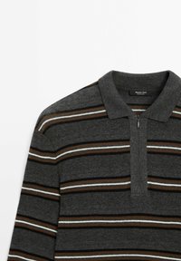 Grey striped polo shirt with a thin zip closure, featuring horizontal stripes in brown, white, and blue on a textured fabric.
