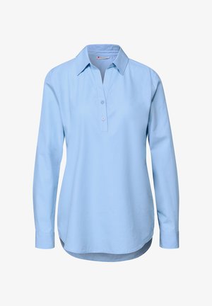 Chemise à manches longues bleu clair avec un col, deux boutons à l'avant, coupe droite et ourlet arrondi. En coton, texture lisse.
