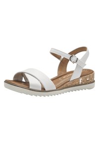 White leather sandals with cross straps, adjustable ankle strap, and a textured cork wedge sole. Light rubber outsole with grooves for traction.
