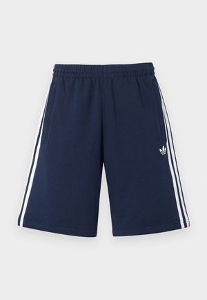 Granatowe szorty sportowe z elastycznym pasem, białymi bocznymi paskami, bocznymi kieszeniami oraz małym białym logo Adidas trefoil na prawej nodze.
