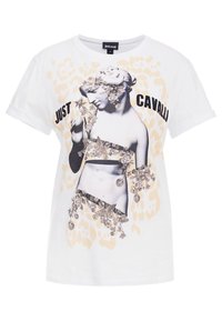 Vit T-shirt med en svartvit grafisk tryck av en staty omgiven av blommönster, med texten "JUST CAVALLI" i fet svarta bokstäver.