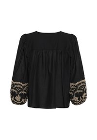 Blouse noire à manches longues, coupe ample avec une broderie florale beige complexe sur les larges manches et un tissu froncé dans le haut du dos.