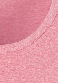 Pink short-sleeve top with a round neckline, featuring a textured fabric and subtle heathered pattern. Soft, lightweight material.