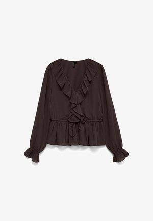 Tumši brūna, ar garām piedurknēm, blūze ar V veida izgriezumu un volānu maliņu. Aprīkota ar auklu jostasvietā un sapulcinātām piedurknēm. Gluda, viegla auduma.