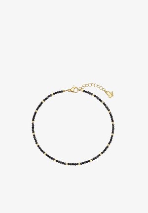 Pulsera delicada con pequeñas cuentas negras y doradas, con un cierre de langosta dorado y una cadena dorada ajustable con un colgante de mariposa.