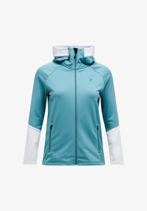 Türkisfarbene Zip-Jacke mit hohem Kragen, weißen Ärmeln und seitlichen Taschen. Weicher, dehnbarer Stoff mit glatter Textur und athletic-fit.