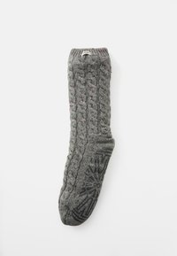 Calza grigia lavorata a maglia con motivo a treccia, caratterizzata da macchie multicolori e una suola in gomma nera testurizzata per una migliore aderenza. Etichetta sul polsino.