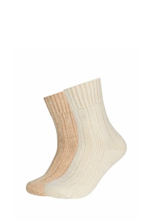 Baumwollmischungssocken in Beige und Off-White. Gerippte Textur mit mittlerer Wadenhöhe. Weiche Oberfläche mit kontrastierenden Tönen und glattem Strick.