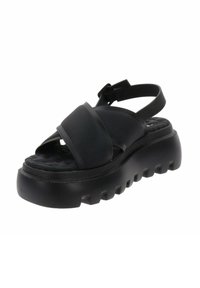 Zwarte platform sandalen met een dikke zool, voorzien van gekruiste banden en een verstelbare enkelband. Gemaakt van soepel, duurzaam materiaal.