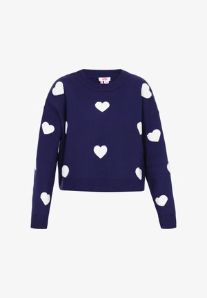 Tumedast kaeluseta kootud sviiter lühikese lõikega, millel on valged südamekujulised mustrid. Ribatud mansetid ja ääred lisavad rõivale tekstuuri.