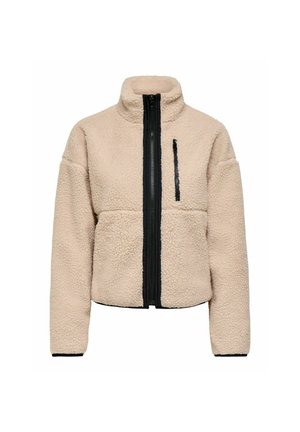 Veste en polaire sherpa beige avec col montant, fermeture éclair noire sur le devant et poche poitrine verticale zippée noire.