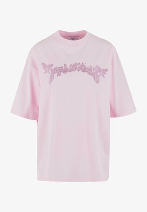 T-shirt di cotone rosa con vestibilità ampia. Presenta maniche corte e un design decorativo di testo in strass luccicanti sulla parte anteriore.
